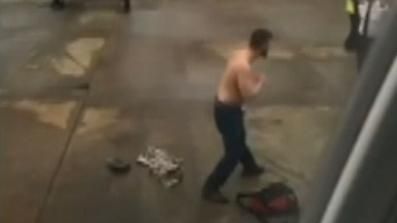 Angry shirtless passenger tries to fight ground crew at Charlotte airport