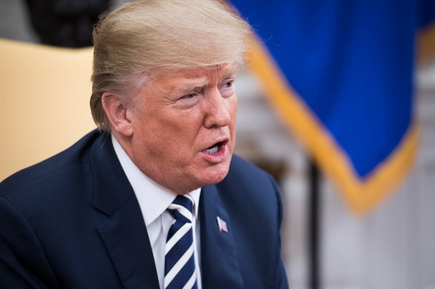 Trump signs $1.3 trillion spending bill despite veto threat on Twitter