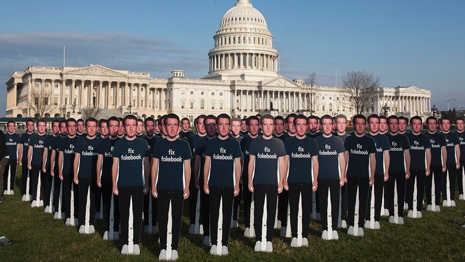 ‘Army’ of 100 Zuckerberg cutouts protests Facebook CEO on Capitol Hill
