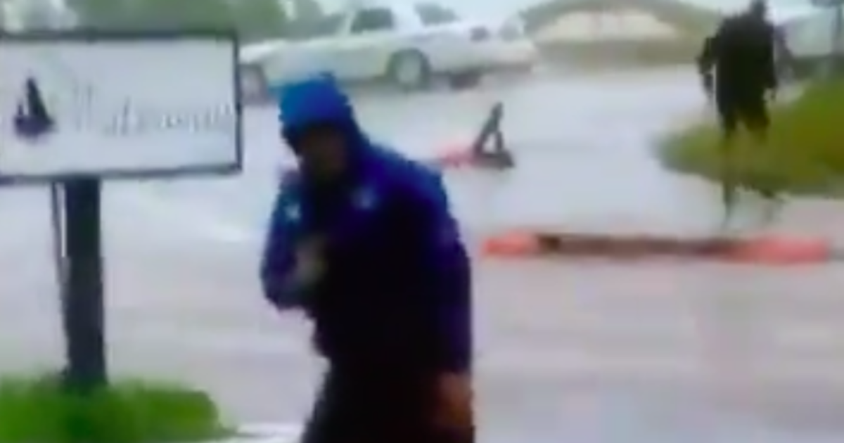 Weatherman Braces For Hurricane Florence While 2 Guys Walk By As If Nothing’s Wrong