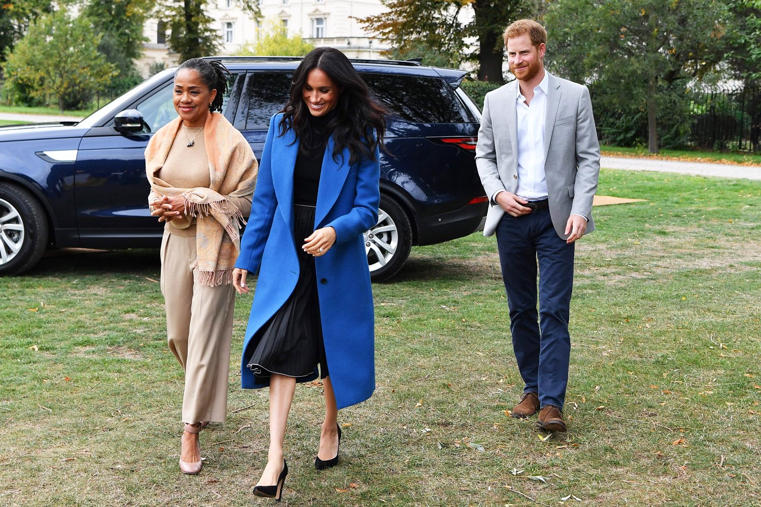 Meghan Markle goes back to her style roots as she steps out with mum and Prince Harry to celebrate charity cookbook