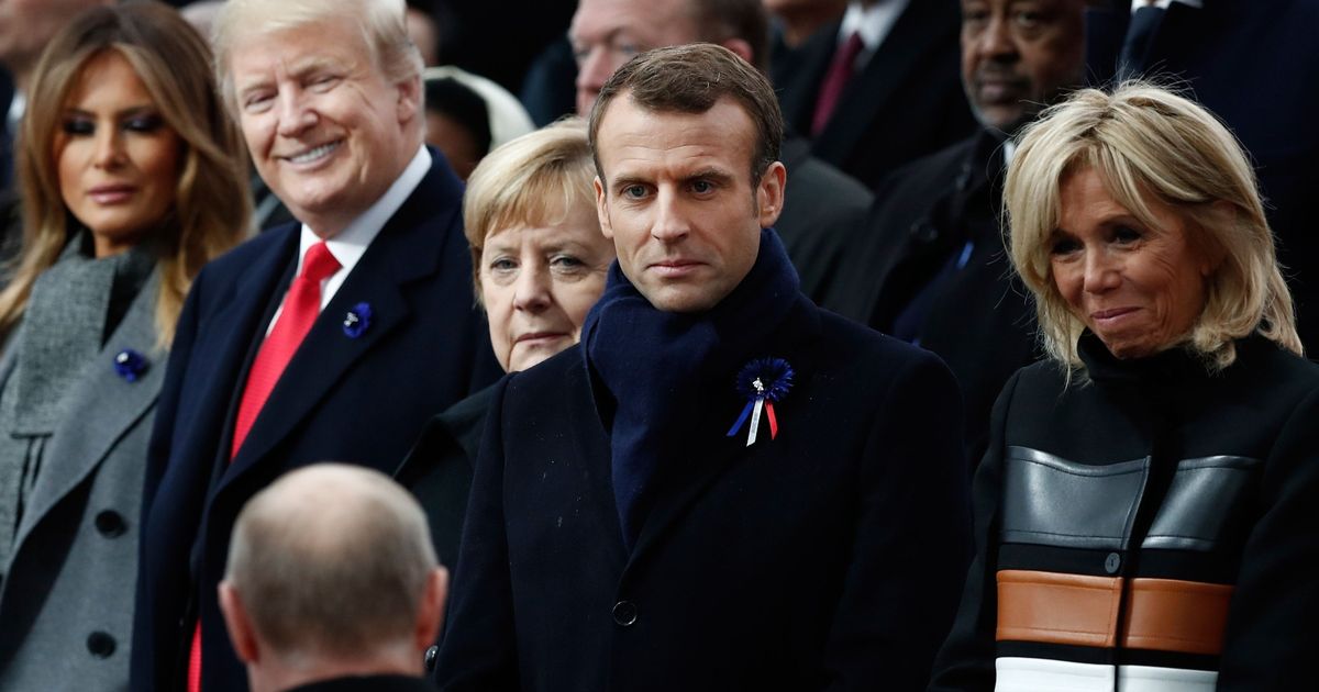 Donald Trump and Vladimir Putin share grin and thumbs-up in Remembrance service