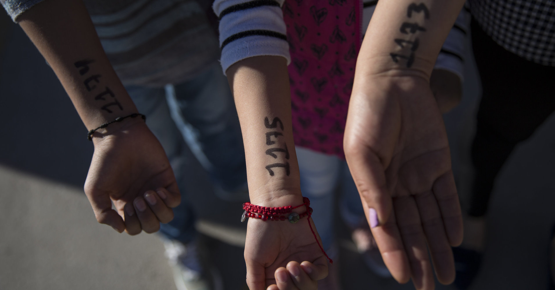 Migrants, blocked at the border, wait turn to apply for asylum