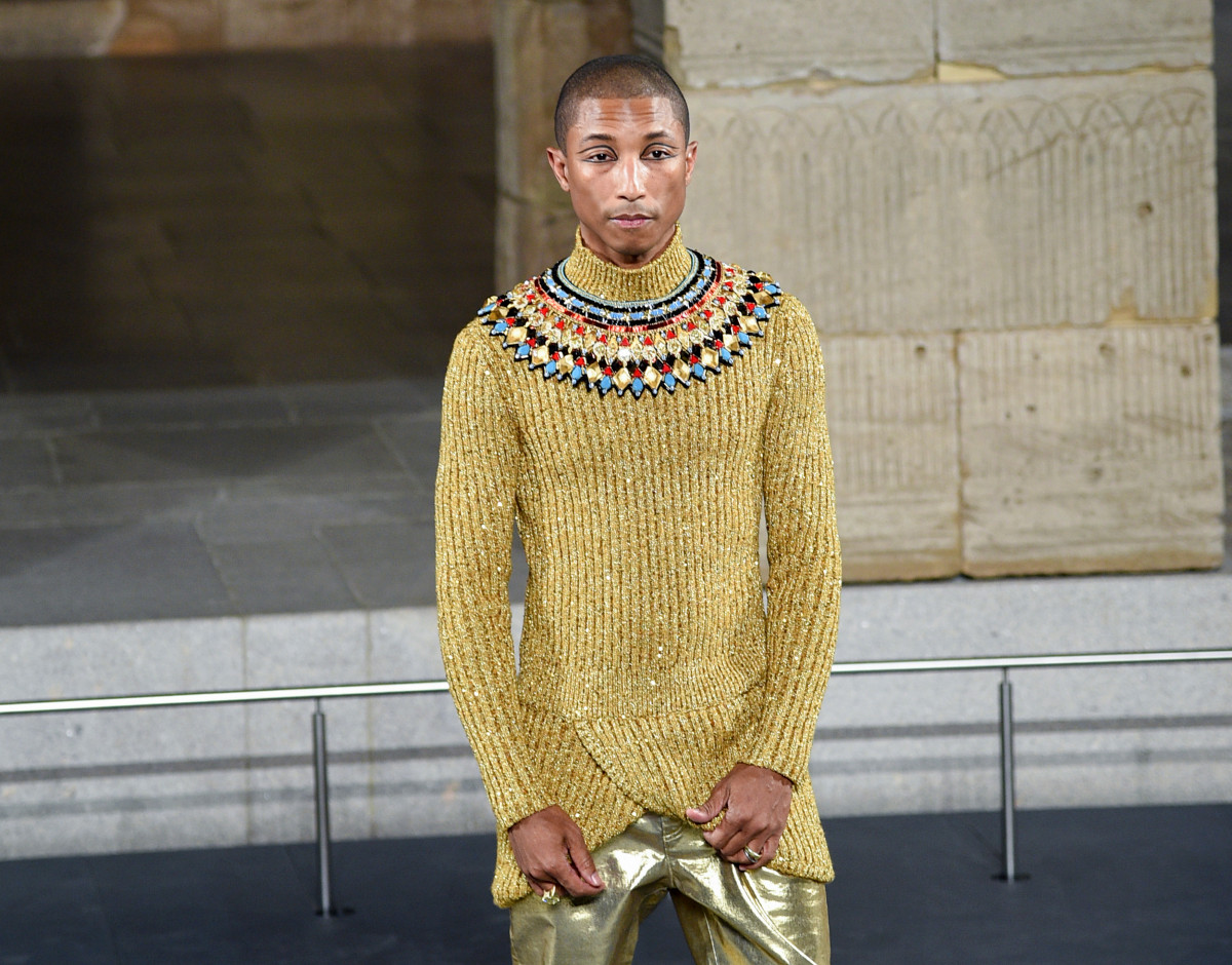 Pharrell glittered in gold on the Chanel runway