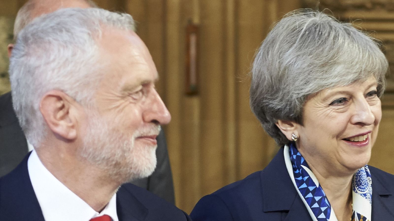 Theresa May and Jeremy Corbyn offer Christmas messages on security and homelessness