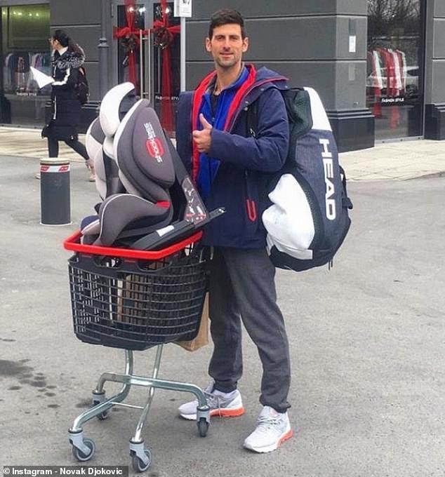 Novak Djokovic goes baby car seat shopping with rackets still on his back