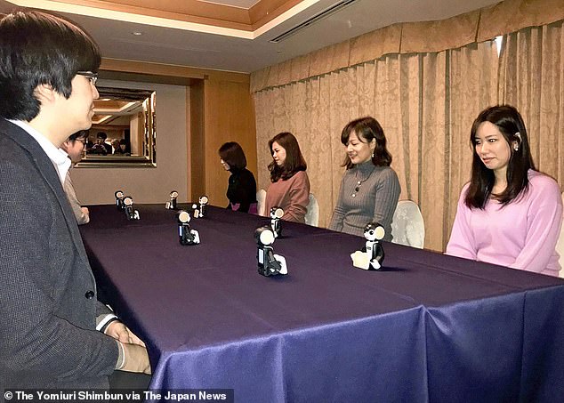 Japanese ‘robot marriage-hunting’ parties see single men and women talk to each other through ROBOTS