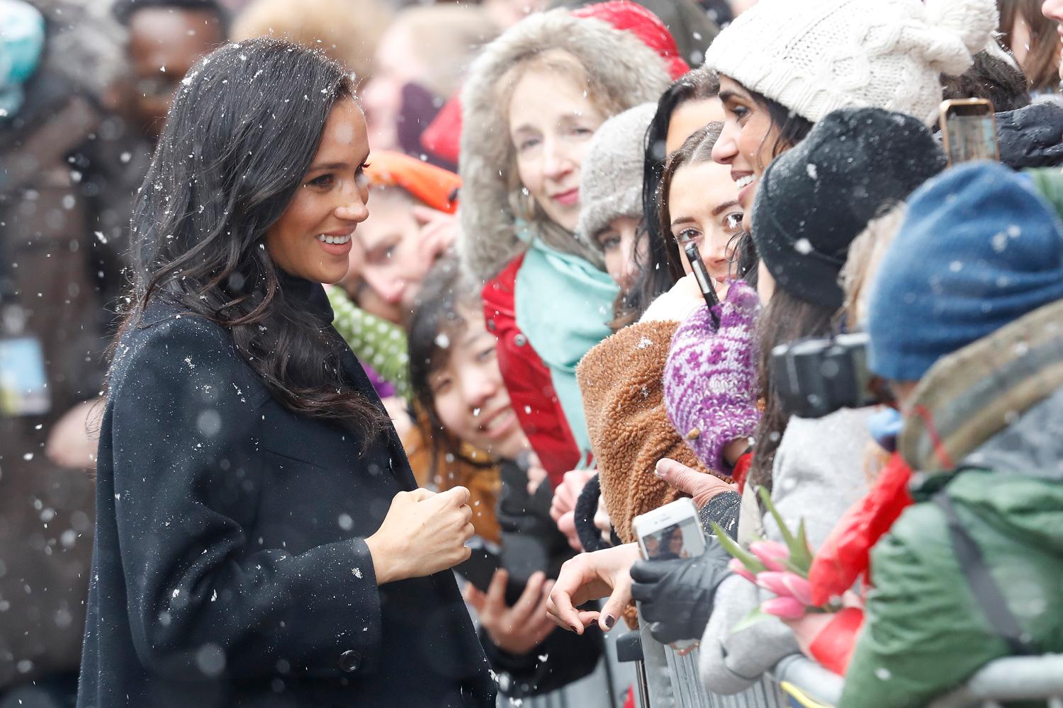 Meghan Markle just weathered a snow storm in knee-high heeled boots
