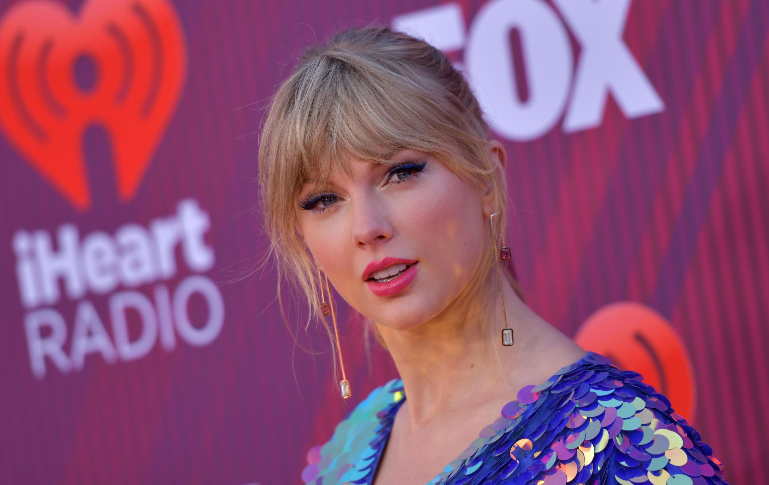 IHeartRadio Awards 2019: Taylor Swift shines on the red carpet in iridescent playsuit and butterfly shoes