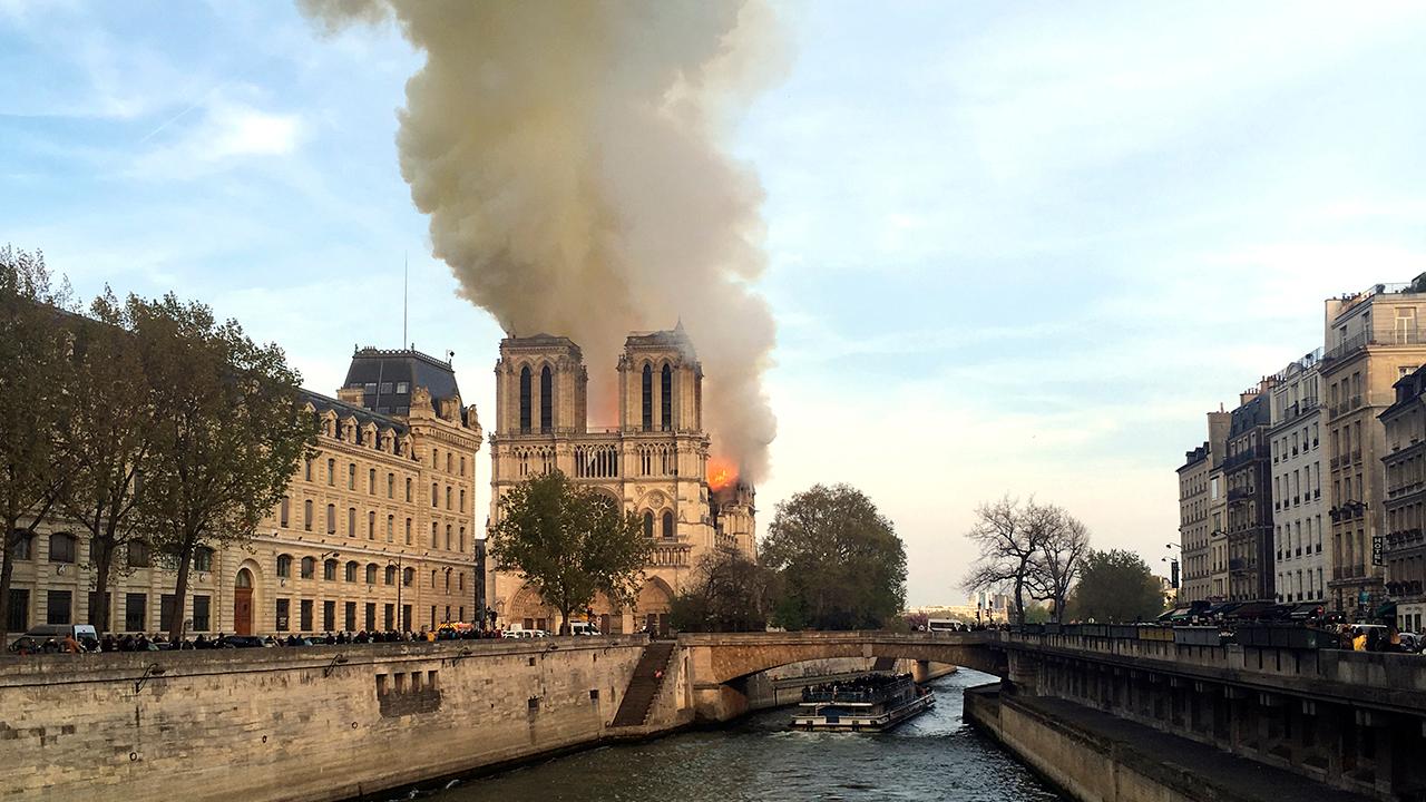 Notre Dame fire: YouTube slammed after live footage appears with link to 9/11 info
