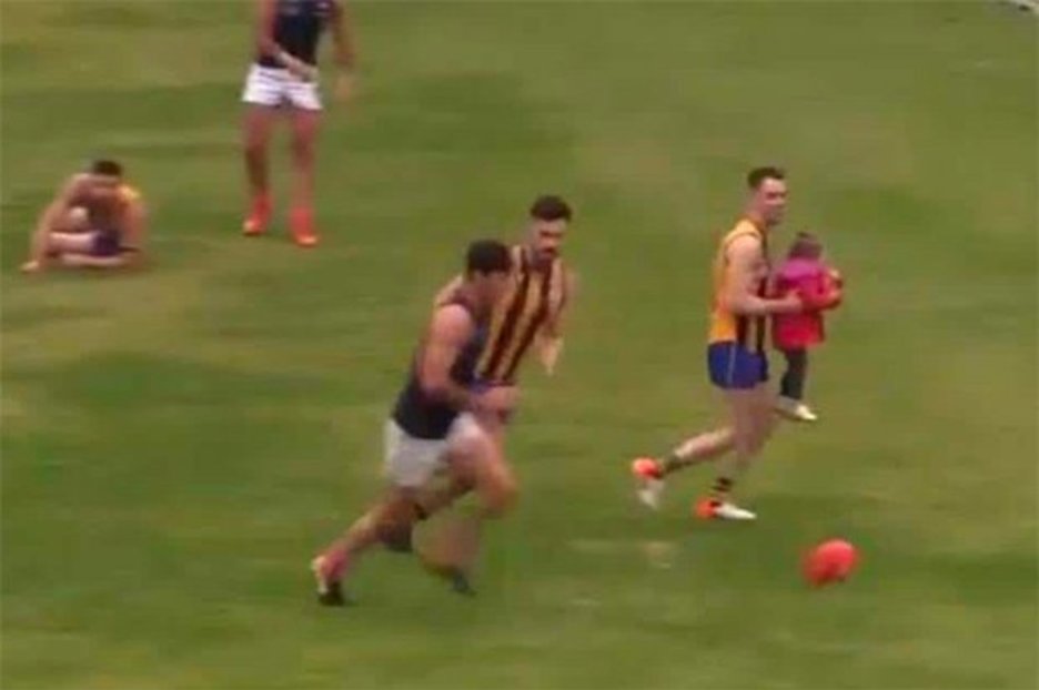 Aussie Rules player saves toddler who wanders into thick of action
