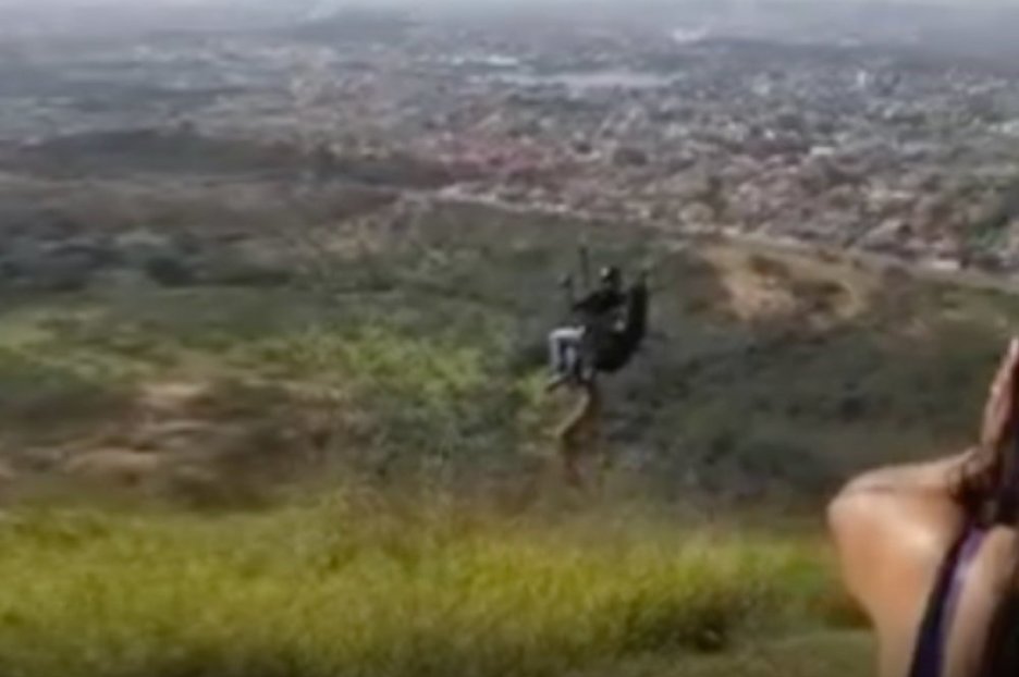 The incredible moment when a dog tries his luck on a hang-glider in Brazil