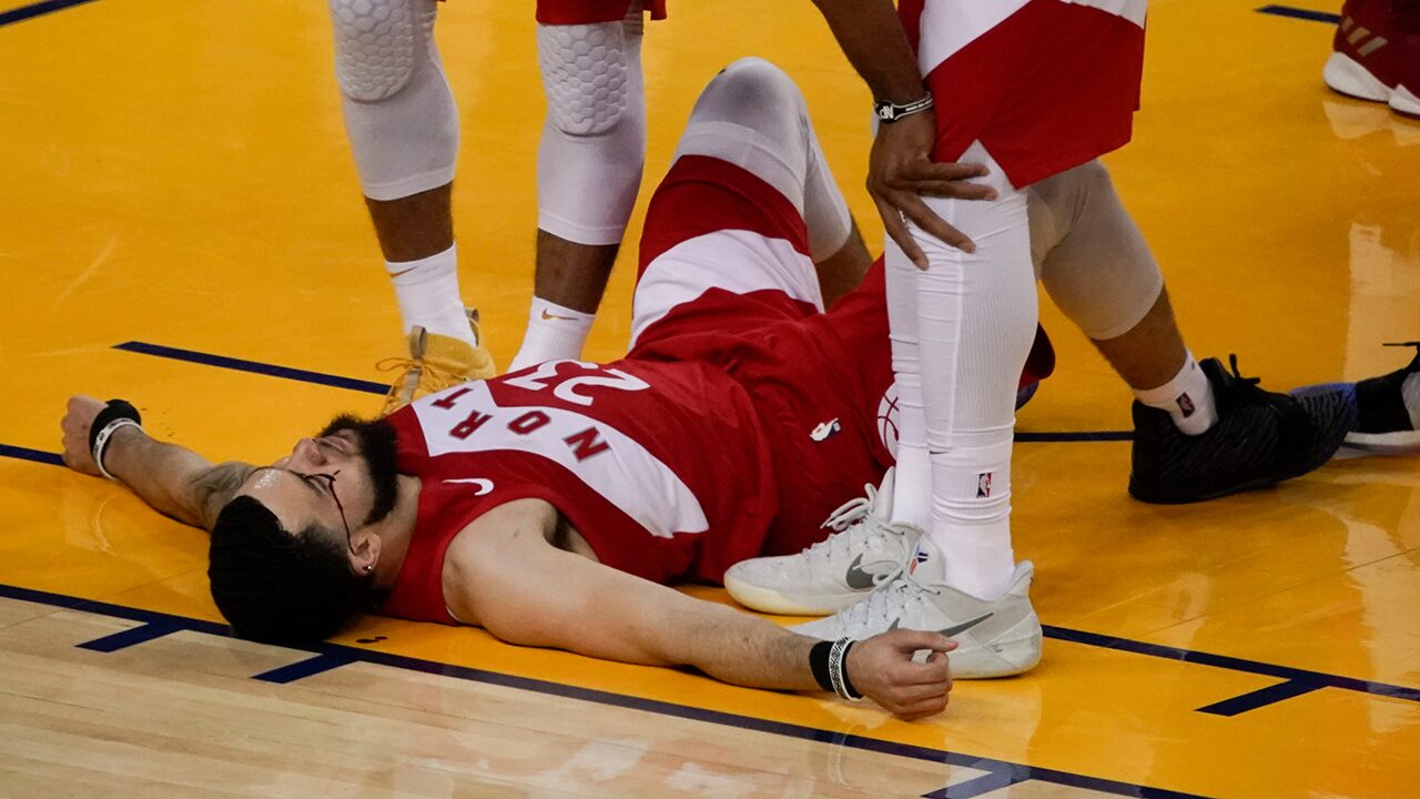 Toronto’s Fred VanVleet takes elbow from Golden State’s Shaun Livingston in Game 4 of NBA Finals