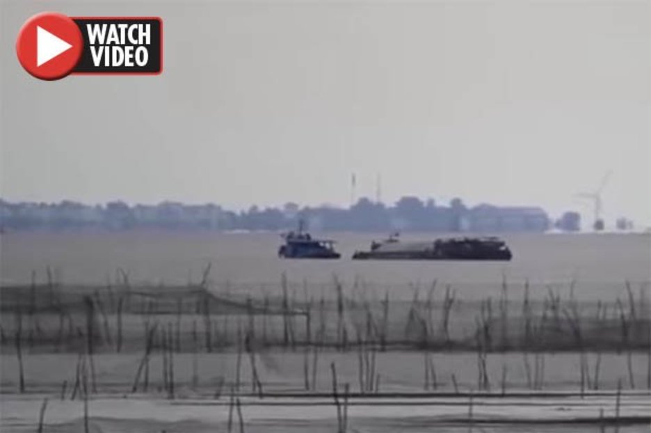 Optical illusion sees ‘ghost city’ with moving turbine appear over lake