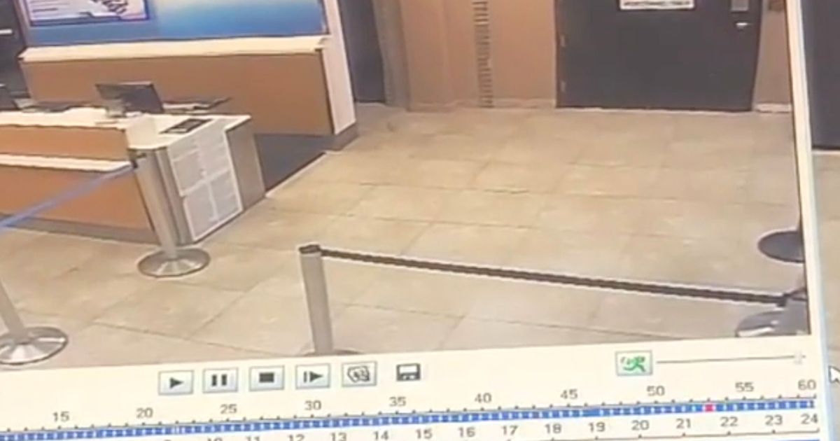‘Shadow’ appears on airport CCTV before security door swings open in spooky clip