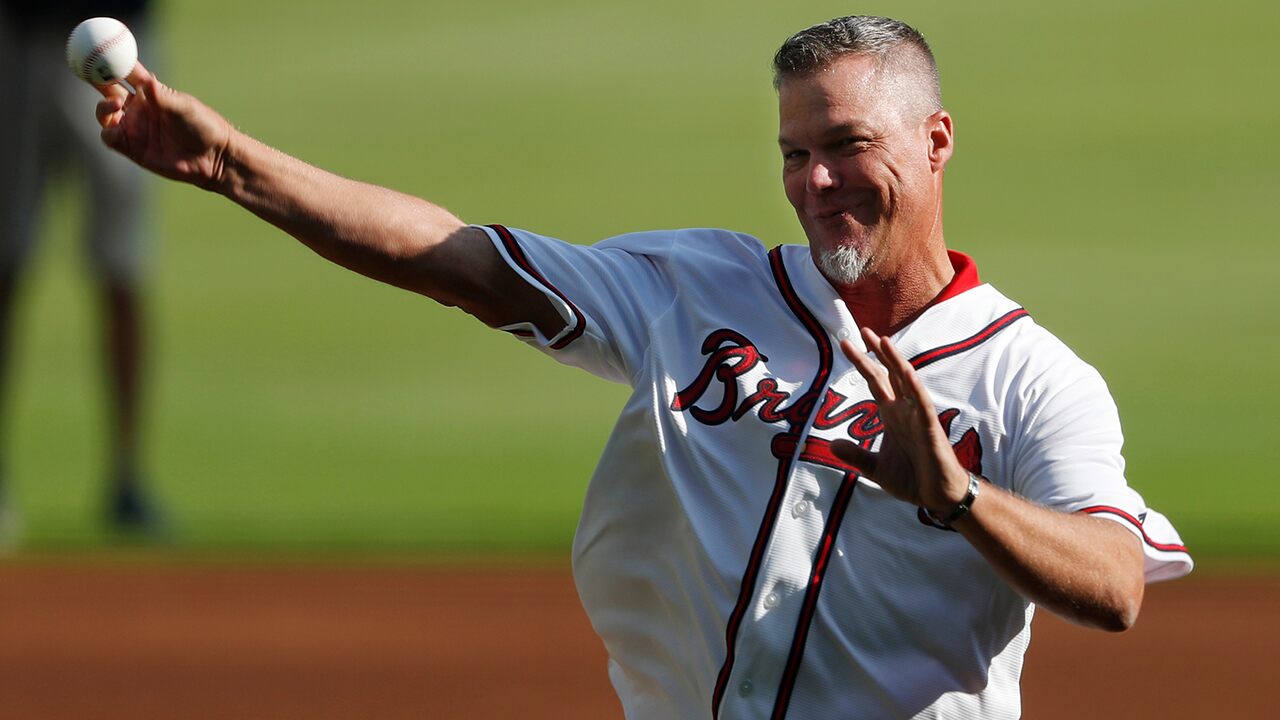 Hall of Famer Chipper Jones catches foul ball from stands during Game 1 of NLDS