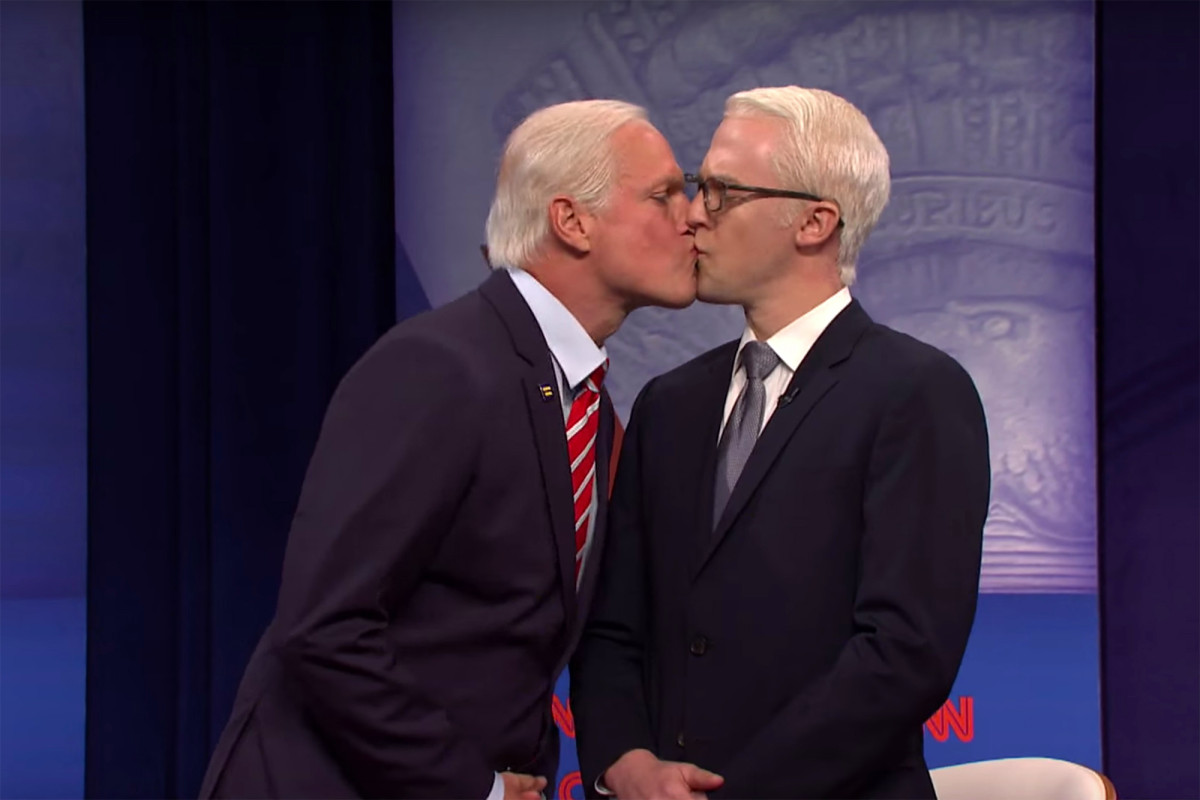 Woody Harrelson plays Joe Biden giving Anderson Cooper a kiss on ‘SNL’
