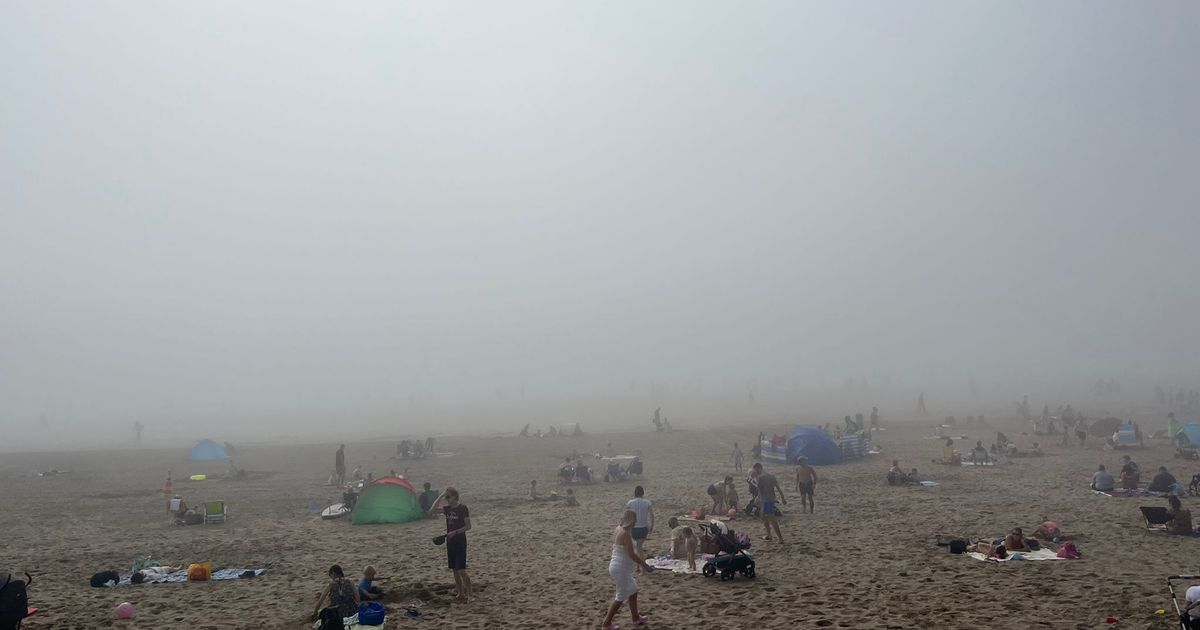 ‘Post-apocalyptic’ scenes as thick fogs blankets Brit beachgoers despite heatwave