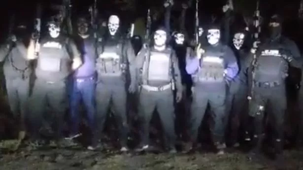 Drug cartel hitmen don creepy Halloween masks and announce 'purge' in chilling video