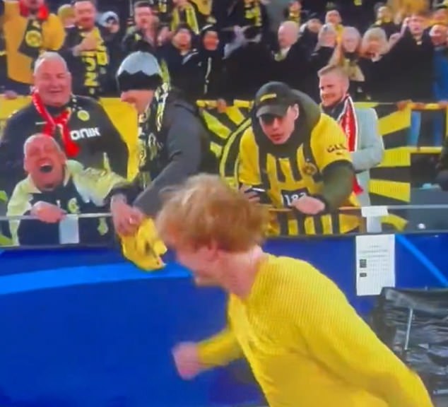 responds to shocking video of Borussia Dortmund supporter STEALING Julian Brandt’s shirt from a fan in a wheelchair… as defender says they will sort the situation