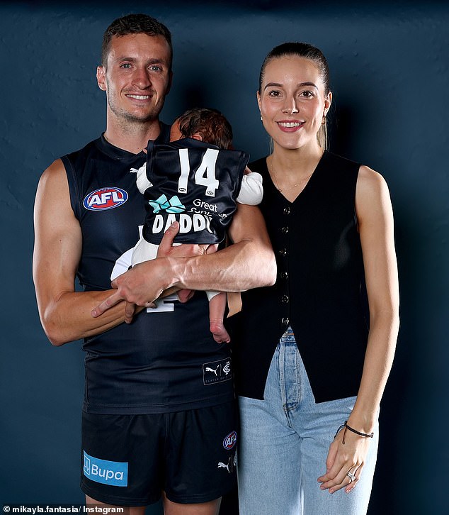 Furious footy WAG names and shames AFL troll who left a horrific one-word slur on photo featuring her baby daughter