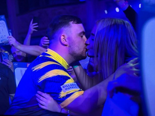 More than ‘just friends’! Luke Littler kisses fun-loving beautician girlfriend in darts crowd – months after emphatically denying they were dating