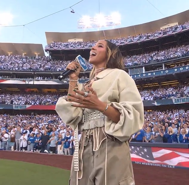 Baseball fans go wild for the ‘most beautiful woman on the planet’ singing national anthem at the World Series