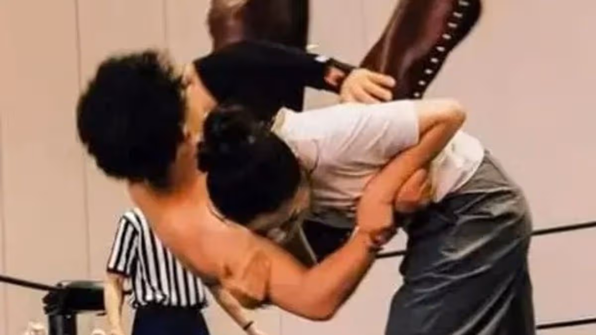 Bride slams groom to floor in wedding wrestling match as loser gets chore duty for life