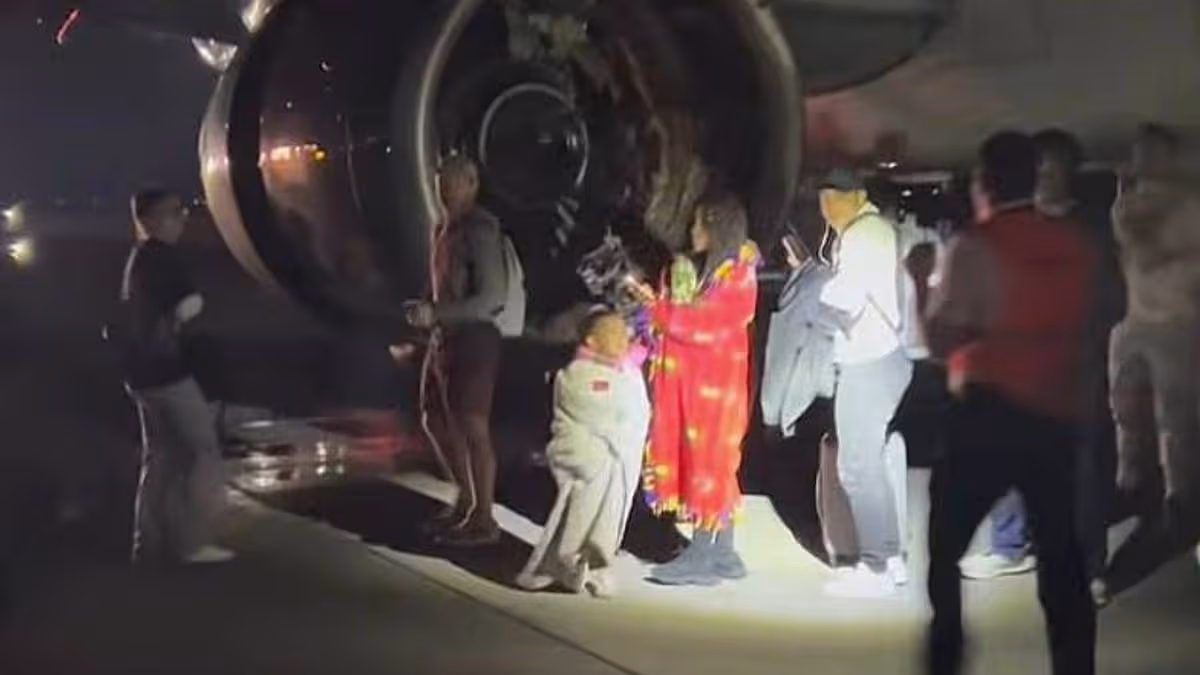 Terrified families flee on slides after plane engine ‘partially consumes’ pedestrian