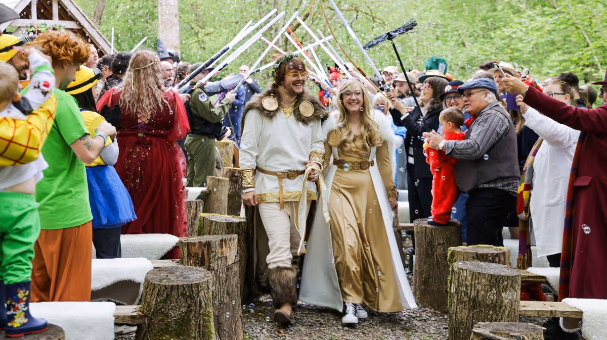 Couple celebrate epic Star Wars-themed wedding with film star guest and lightsaber rings