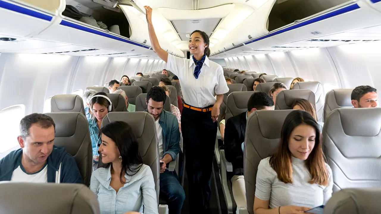 Flight attendants urge passengers to stop touching them for attention