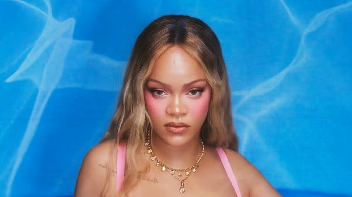Rihanna makes a splash in plunging sheer lingerie for seductive pool photoshoot